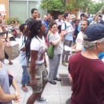 NYCHA Allies members Harriet Putterman (green bag in the middle) and Tito Delgado (blue shirt, dark hat holding sign)